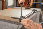 Synchronisatiestang voor tabletladestop